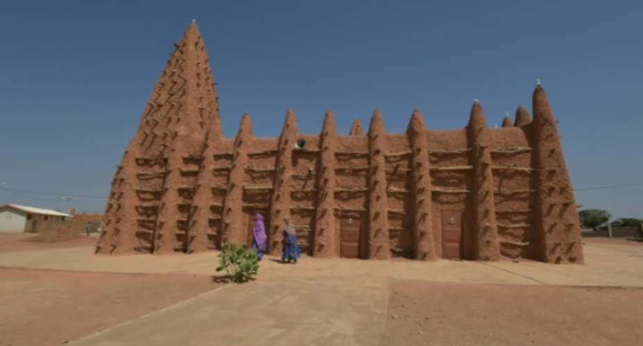 Devotees at one of Kong's two mosques, historic treasures built in the Sudanese style suited to the hot and arid climes of the Sahel.  By SIA KAMBOU AFPFile