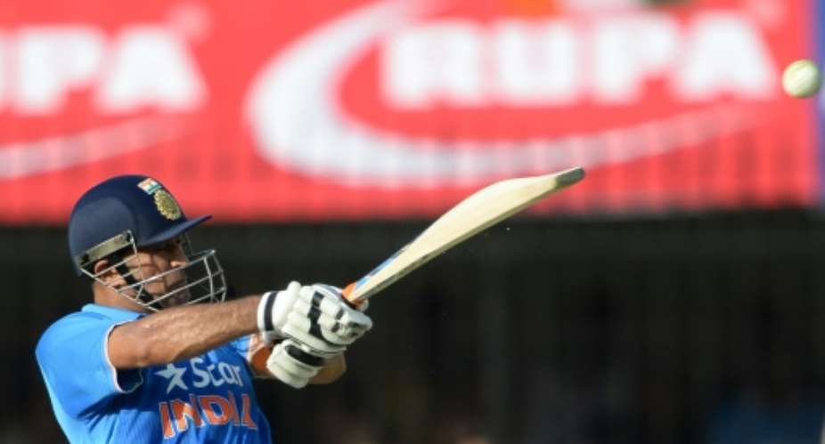 Indian captain Mahendra Singh Dhoni bats during the second one-day international against South Africa in Indore on October 14, 2015.  By Indranil Mukherjee (AFP)