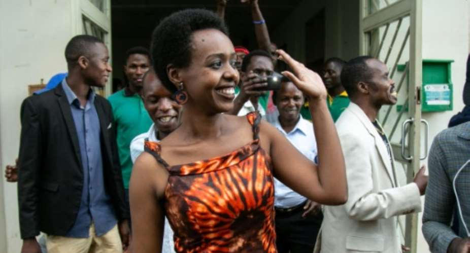 Diane Rwigara waves as she leaves the High Court on December 6 after judges dropped charges against her. The prosecution says it will appeal..  By Cyril NDEGEYA AFP