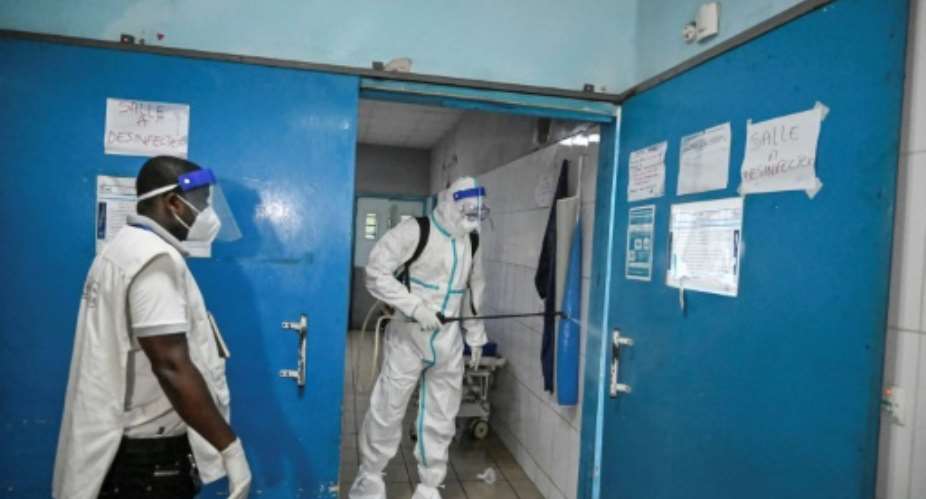 Disinfection after an Ebola patient from Guinea was admitted to hospital in Abidjan last Thursday.  By Sia KAMBOU AFP