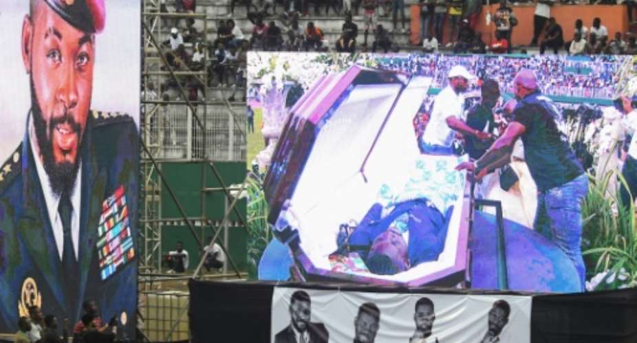 DJ Arafat's coffin was placed at the centre of the football pitch.  By ISSOUF SANOGO AFP