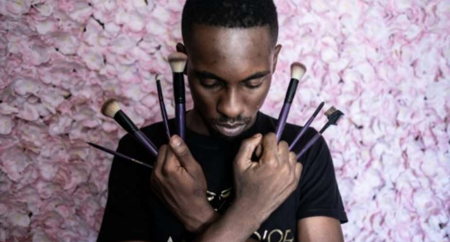 Djibril Gueye, also known as Djibou, became a make-up artist after learning his skills on YouTube.  By Barbara DEBOUT AFP