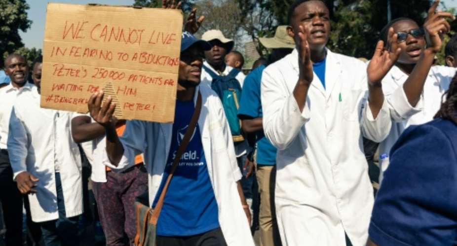 Doctors and medical staff have marched in Harare to protest over Magombeyi's disappearance.  By Jekesai NJIKIZANA AFP