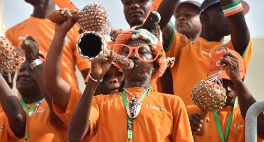 Ivory Coast's supporters cheer ahead of the 2015 African Cup of Nations football match between Ivory Coast and Guinea in Malabo on January 20, 2015.  By Issouf Sanogo AFP