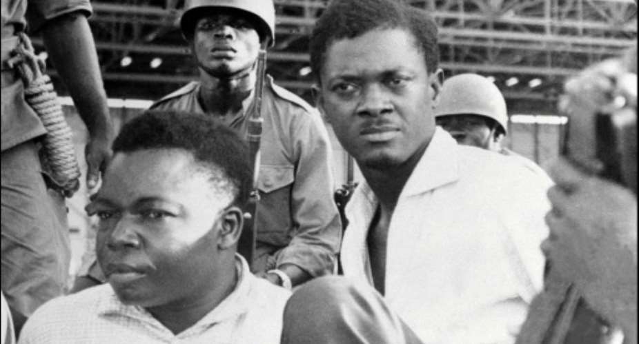 Downfall: Congolese independence hero Patrice Lumumba, right, and Joseph Okito, the vice president of the senate, pictured on their arrest in December 1960 in Leopoldville, now Kinshasa.  By - AFPFile
