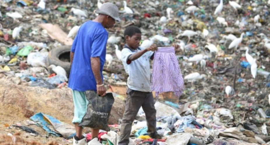 Dozens of children live and work around the Mindoube dump in Libreville.  By Steeve Jordan AFP