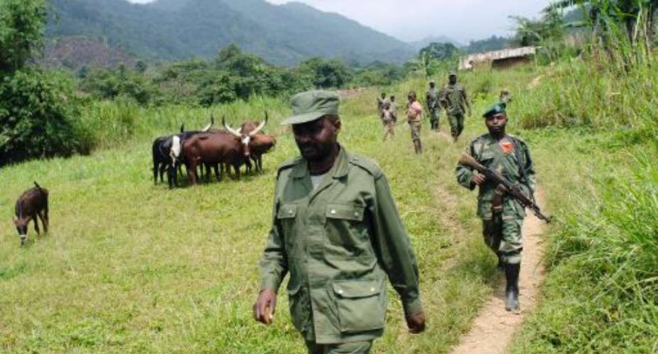 General Janvier Buingo Karairi, the leader of  the APCLS, walks in Lukweti, north Kivu, on August 22, 2012.  By Michele Sibiloni (AFP/File)