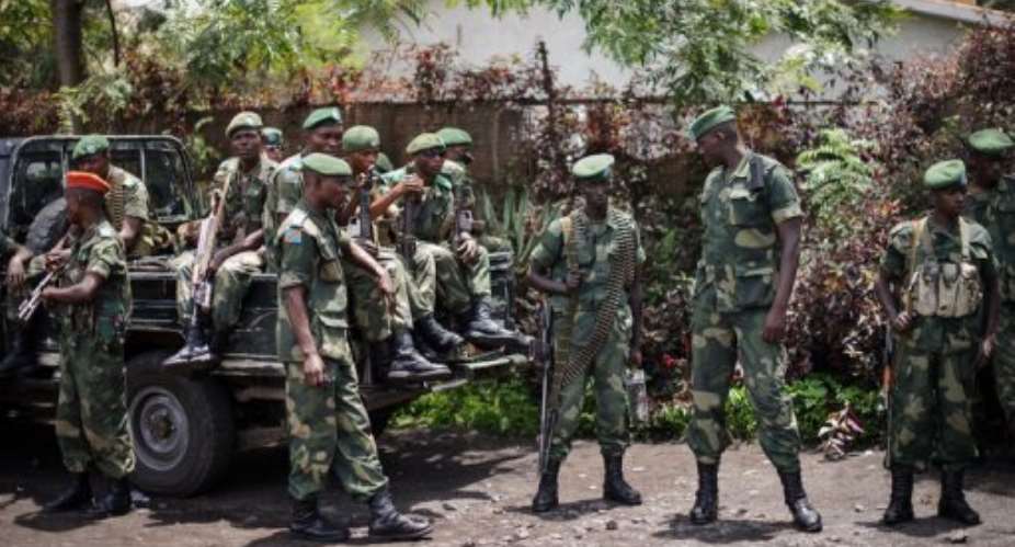 Soldiers of the Democratic Republic of Congo Armed Forces stand outside a general's residence in Goma.  By Phil Moore AFPFile