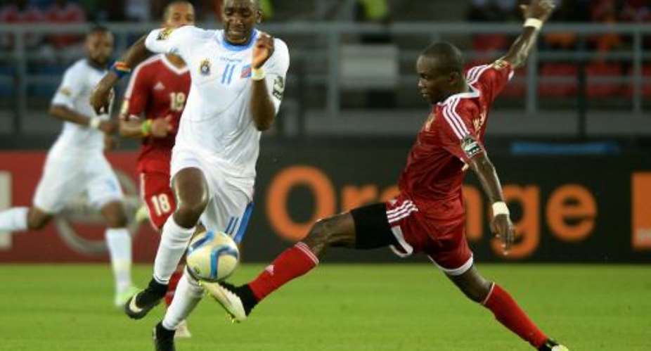 Democratic Republic of the Congo's forward Yannick Bolasie L vies with Congo's defender Boris Moubio Ngonga during their 2015 African Cup of Nations quarter final football match in Bata, on January 31, 2015.  By Khaled Desouki AFP
