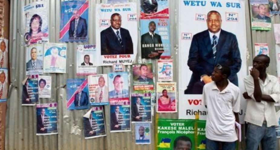 Tshisekedi supporters gathered along the main airport road to greet the veteran politician on the last day of campaiging.  By Phil Moore (AFP/File)