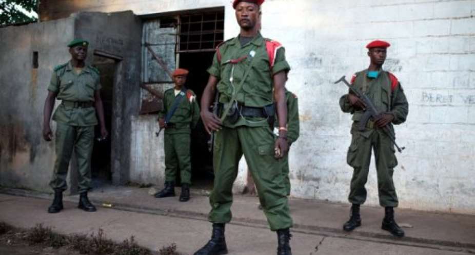 Soldiers guard the Mbandaka military prison in northwest DR Congo in April last year.  By Gwenn Dubourthoumieu AFPFile