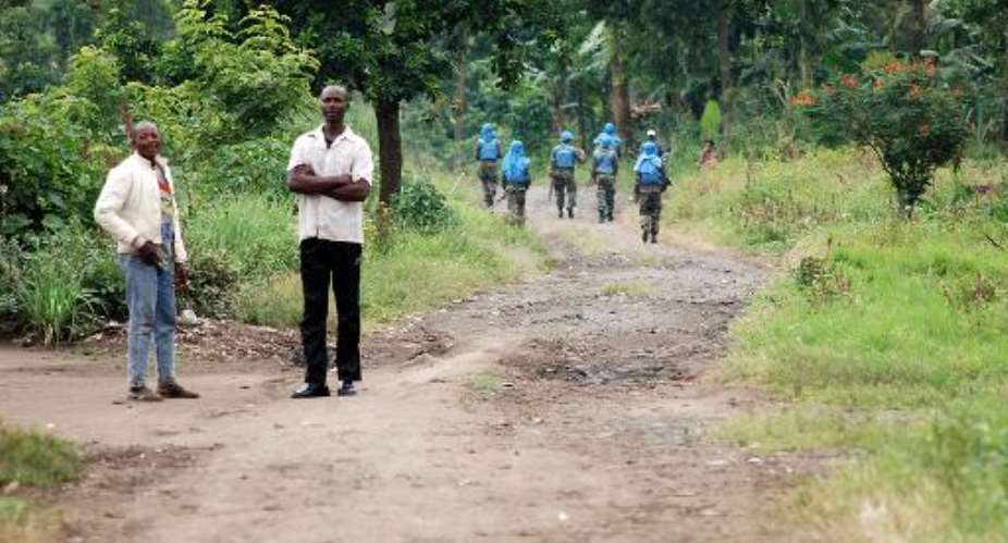 Indian peacekeepers of the UN mission in the DR Congo patrol on March 11, 2014 on a road near Tongo, some 45 km north of Goma.  By Alain Wandimoyi AFPFile