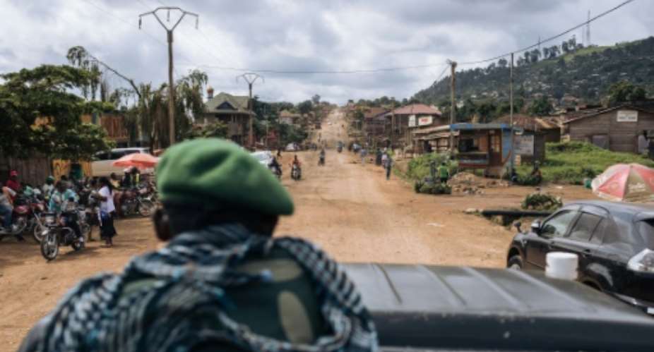 DR Congo troops patrolling the highway between Beni and the Ugandan border. The ADF has attacked the road and nearby villages dozens of times this year.  By ALEXIS HUGUET AFP