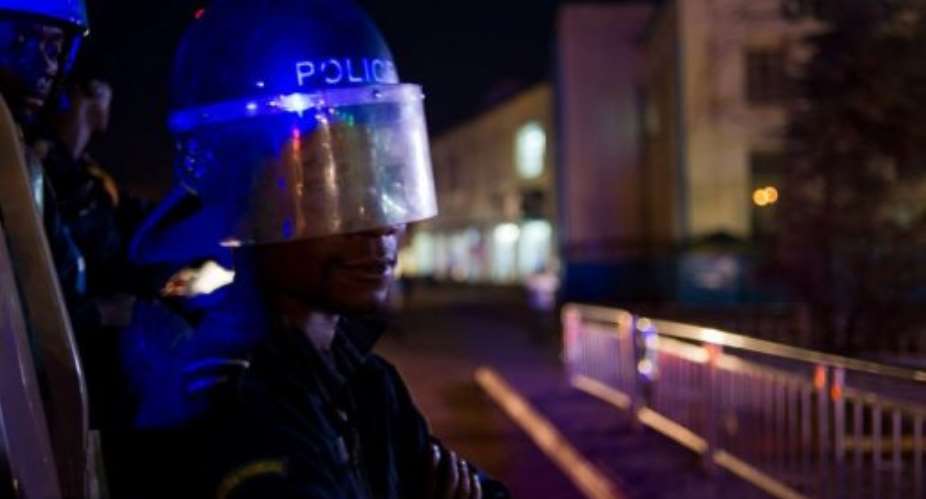 A riot policeman poses in the Post-Office Square  in central Lubumbashi.  By Phil Moore (AFP)