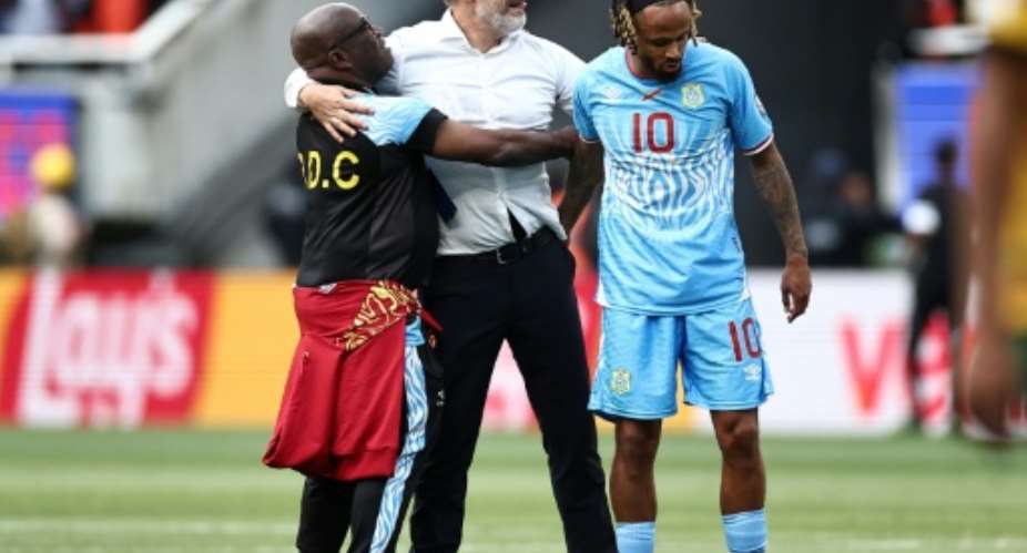DR Congos French head coach Sebastien Desabre (C) has not given up hope of their friendly match against Chile going ahead.  By Ulises Ruiz (AFP)