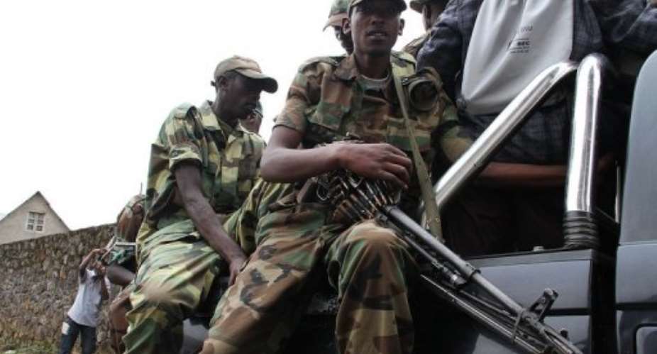 M23 rebels army keep security in Bunagana on January 3, 2013.  By Isaac Kasamani (AFP/File)