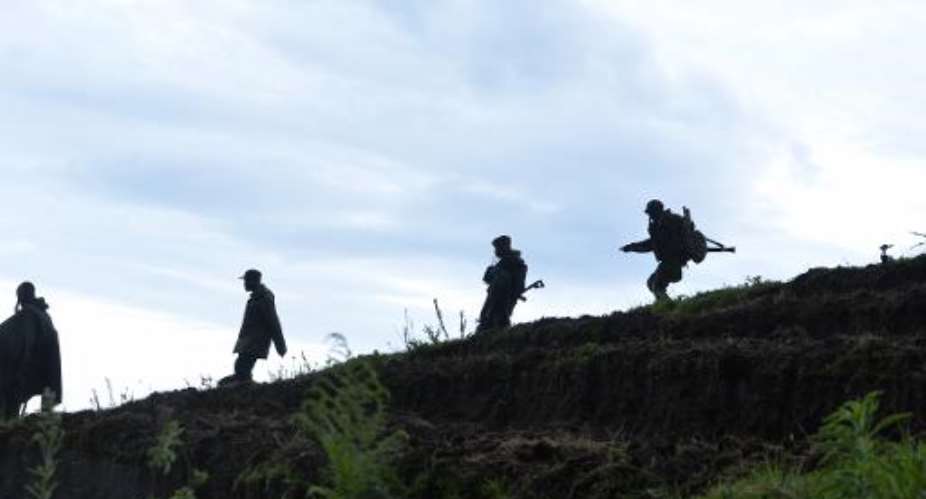Democratic Republic of Congo soldiers advance on November 5, 2013 near Chanzu, in the eastern North Kivu region.  By Junior D. Kannah AFPFile