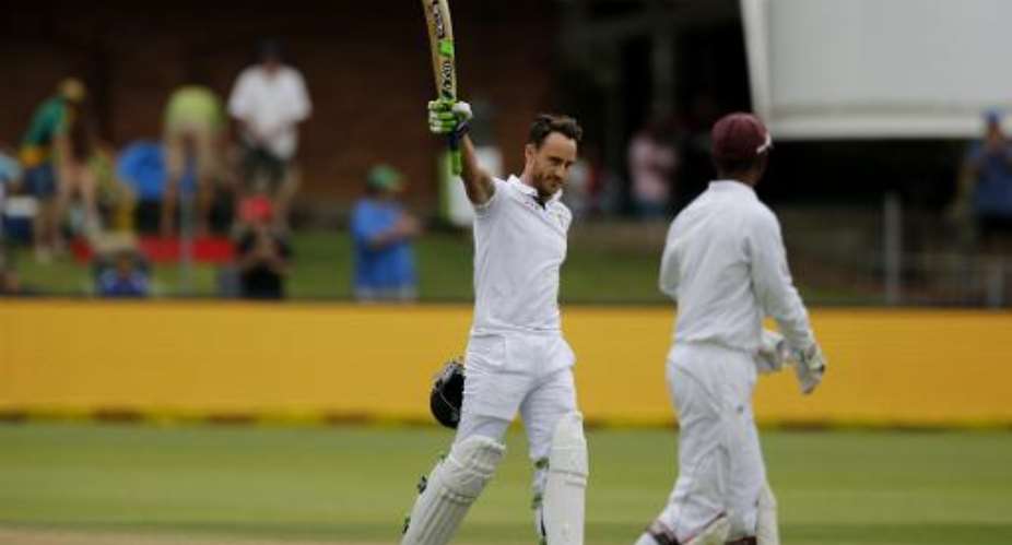 South Africa's Faf du Plessis L celebrates reaching a century on the second day of the second Test against West Indies at St George's Park in Port Elizabeth on December 27, 2014.  By Marco Longari AFP