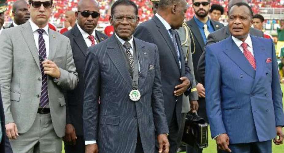 Equatorial Guineas President Teodoro Obiang (centre left) attends the Africa Cup of Nations group match between Equatorial Guinea and Congo at Bata Stadium in Bata on January 17, 2015.  By Carl De Souza (AFP/File)