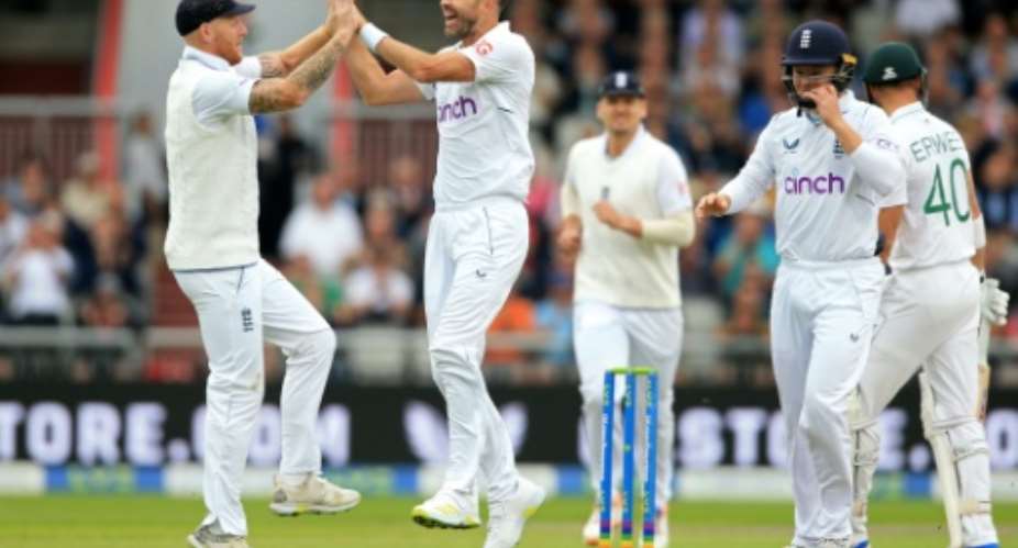 Early blow - James Anderson 2nd L celebrates with England captain Ben Stokes L after dismissing South Africa opener Sarel Erwee in the second Test at Old Trafford.  By Lindsey Parnaby AFP