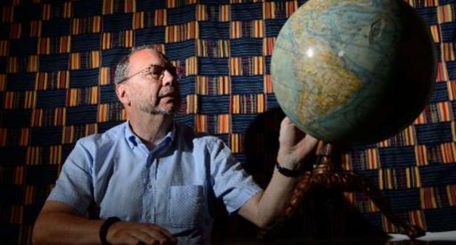 Professor Peter Piot, the Director of the London School of Hygiene and Tropical Medicine, poses for photographs following an interview at his office in central London, England, on July 30, 2014.  By Leon Neal AFP