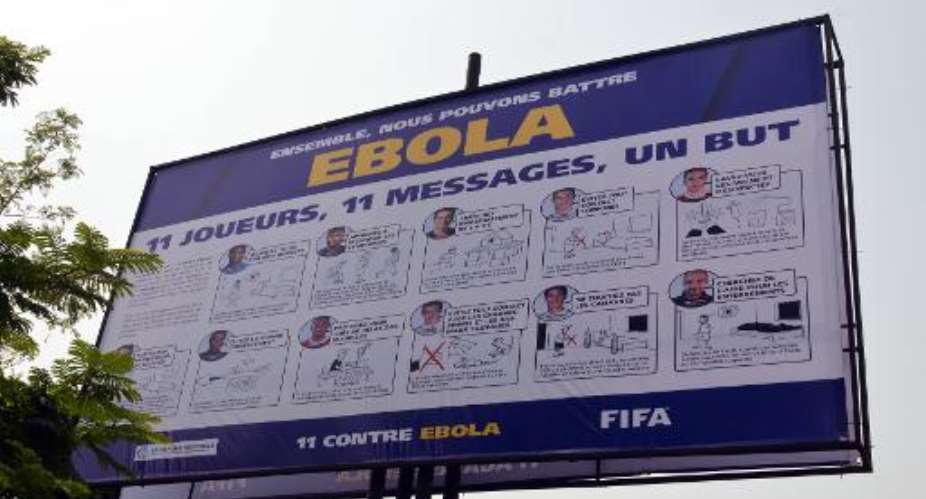 A board bearing the 11 against Ebola, a joint campaign between FIFA, the CAF and health experts, to raise awareness in the fight against Ebola on December 17, 2014.  By Zoom Dosso AFPFile