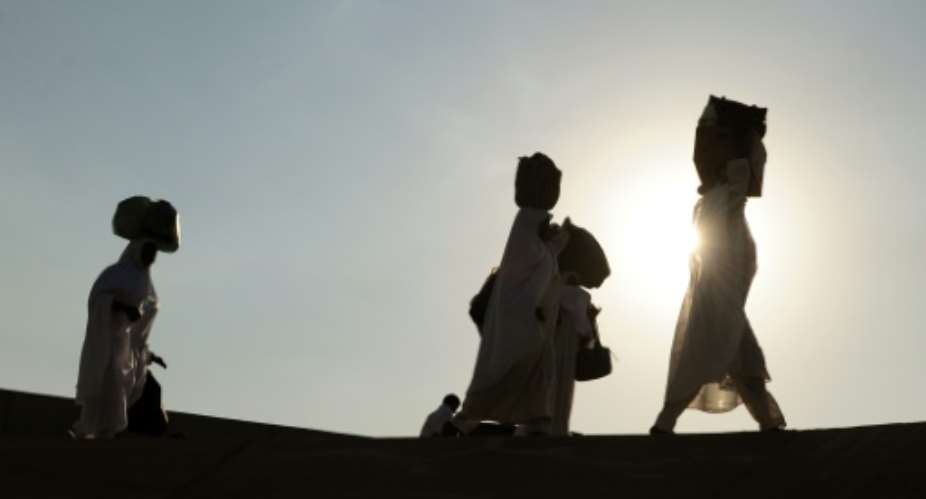 Muslim pilgrims arrive at the Mina valley five kilometres east of the Saudi Arabian holy city of Mecca, on November 14, 2010.  By Mustafa Ozer AFPFile