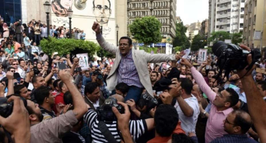 Editor Khaled Elbalshy C, pictured at a demonstration in Cairo on May 4, 2016, told AFP he submitted a complaint to the Egyption Journalists' Union demanding to know why and under what authority Al-Bedaya, along with other news sites, was blocked.  By MOHAMED EL-SHAHED AFPFile