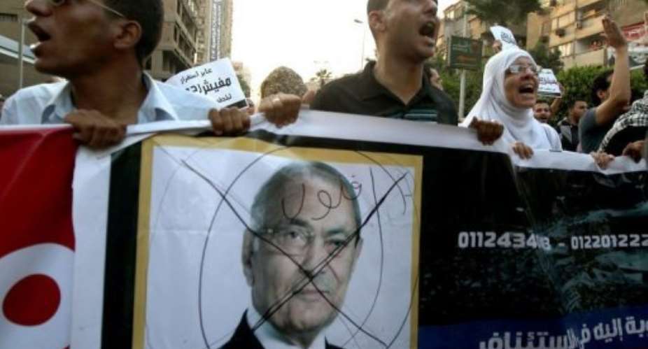 Egyptian protesters shout slogans against presidential candidate Ahmed Shafiq.  By Marwan Naamani AFP