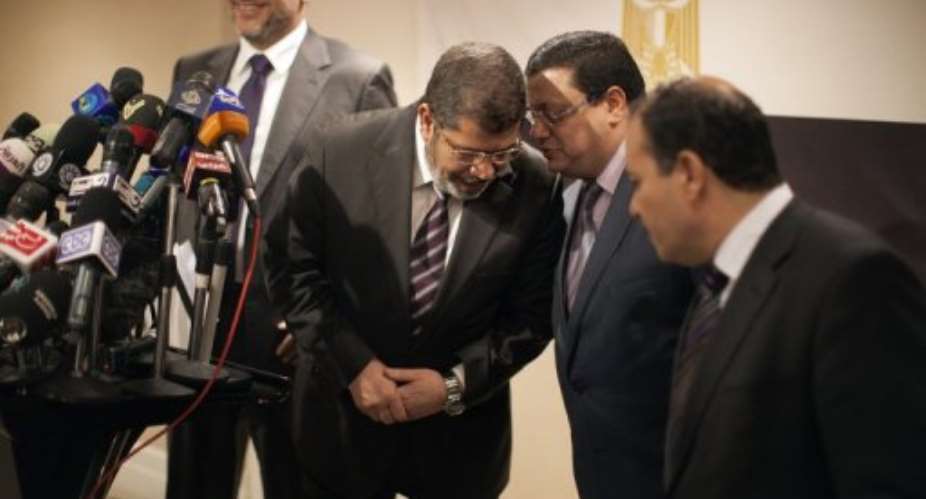 Mursi appealed to Egyptians to pursue the goals of the revolution.  By Marco Longari (AFP)