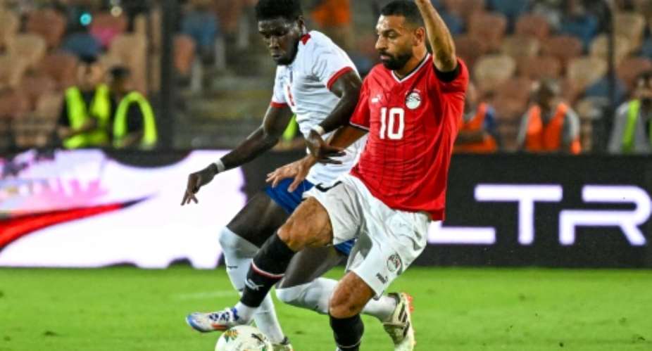 Egypt captain Mohamed Salah (R) has scored seven goals in 2026 World Cup qualifying..  By Khaled DESOUKI (AFP)