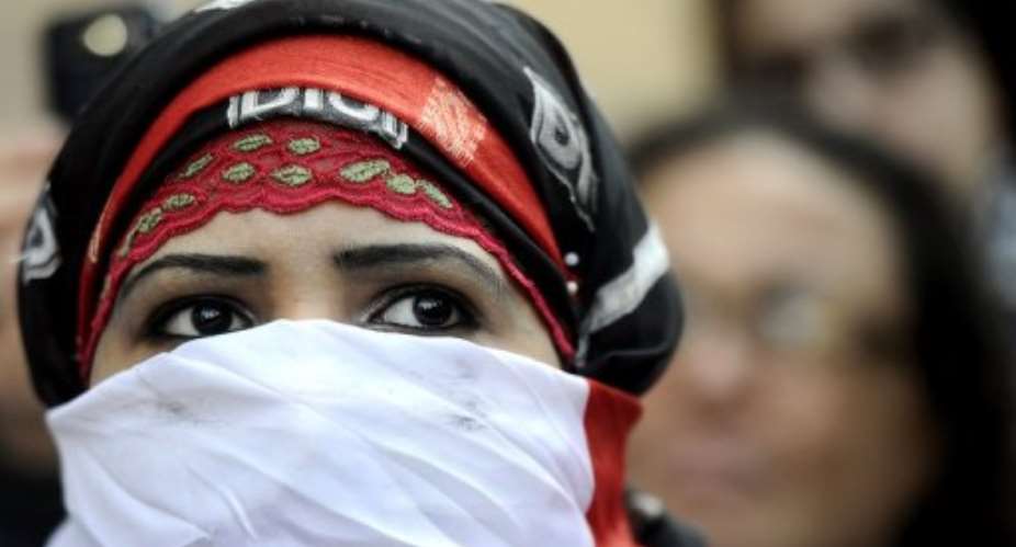 Egyptian women protest against the military council violations and virginity tests.  By Filippo Monteforte (AFP)