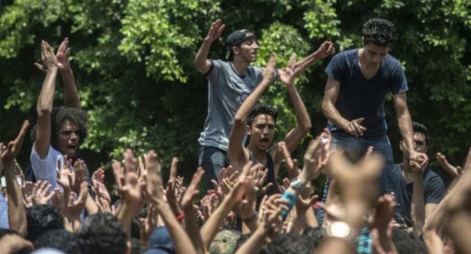 Egyptian students shout slogans during a demonstration against the education minister and the education system outside the Ministry of Education in the capital Cairo on June 27.  By Khaled Desouki AFPFile