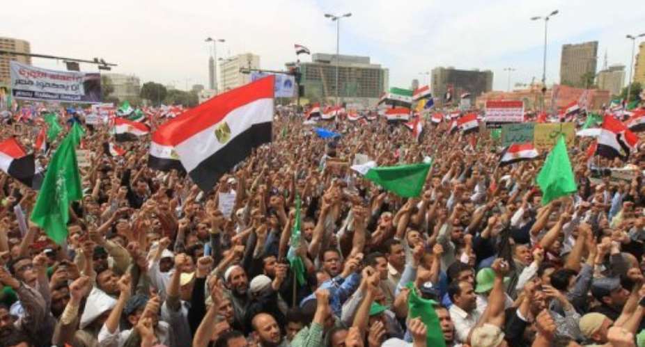 Thousands of Egypts Muslim Brotherhood and Salafist movement supporters take part in a demonstration.  By Khaled Desouki (AFP/File)