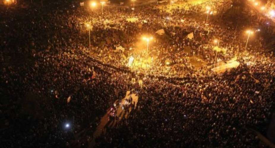 Thousands of Egyptians protesters gather in Tahrir Square in Cairo.  By Mahmud Khaled AFP