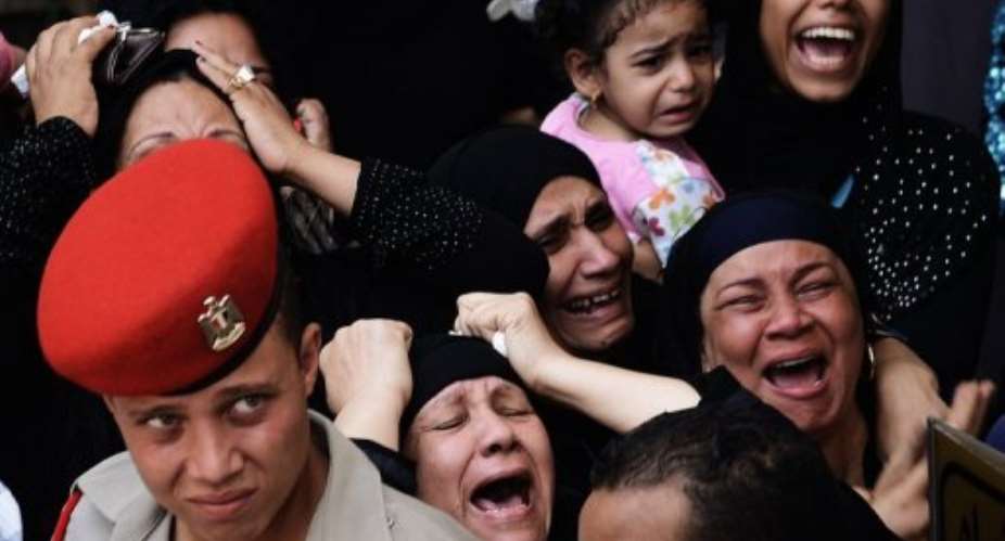 Relatives mourn one of the soldiers.  By Gianluigi Guercia (AFP)