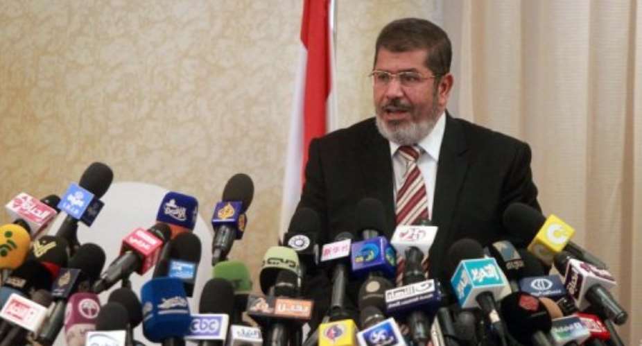 Mohammed Mursi says Christians in Egypt are national partners and have full rights like Muslims.  By Khaled Desouki AFP