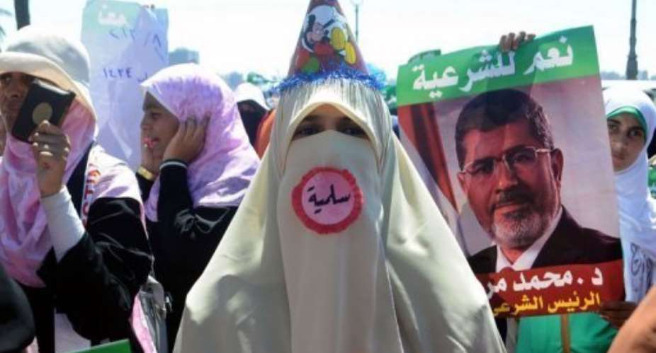 A supporter of Egypt's deposed president Mohamed Morsi attends a demonstration in Alexandria, on August 3, 2013.  By  AFP