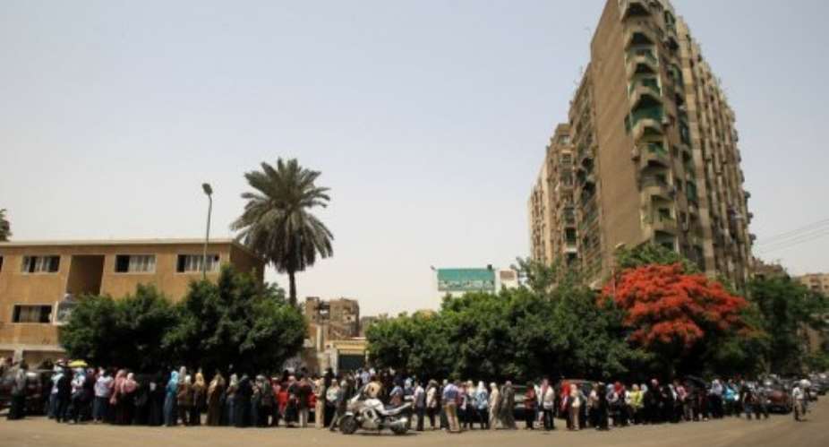 Voters are lining the streets of Cairo in Wednesdays historic elections.  By Mahmud Hams (AFP)