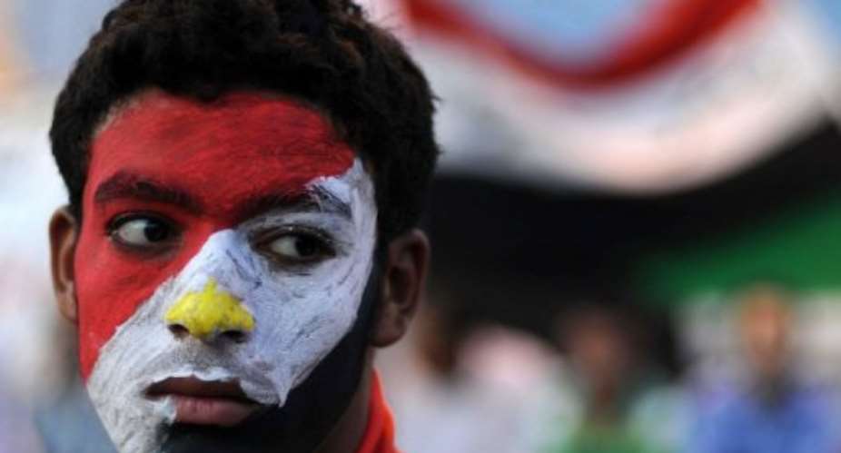 An Egyptian man camps out in Cairos Tahrir Square on Monday.  By Mohamed Hossam (AFP)