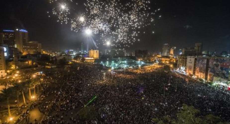 Egyptians celebrate in Cairo's Tahrir Square on June 3, 2014 after ex-army chief Abdel Fattah al-Sisi the presidential election.  By Khaled Desouki AFPFile