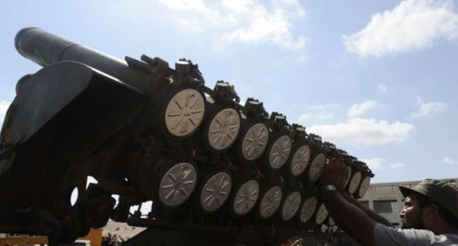 A Libyan paramilitary checks his Grad rocket launcher during clashes on the outskirts of Sirte in  September 2011.  By Francisco Leong (AFP/File)