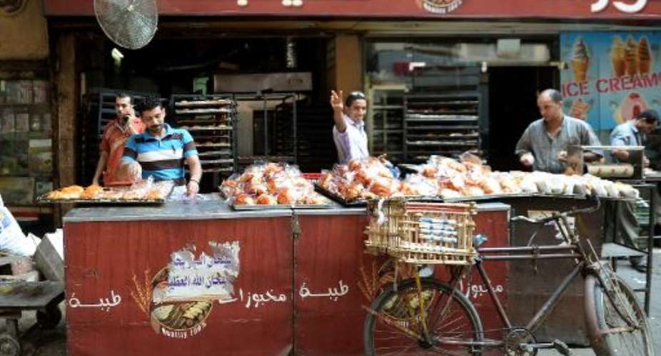 Egyptian bakers prepare croissants at a bakery in a popular Cairo street on August 26, 2013.  By Marwan Naamani AFPFile