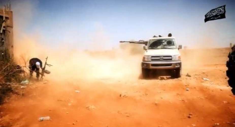Video grab made available on October 9, 2014 by the official Islamist media outlet of Benghazi-based Islamist Ansar al-Sharia group allegedly shows militants from the group during a battle in Benghazi, Libya.  By  Al-Raya Media FoundationAFPFile