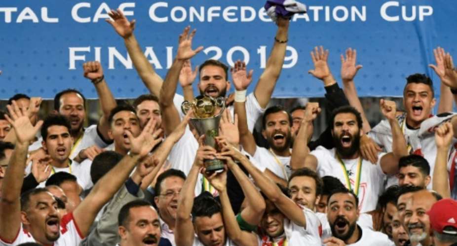 Egyptian club Zamalek celebrate winning the 2019 CAF Confederation Cup. They will not defend the title having qualified for the richer CAF Champions League.  By Khaled DESOUKI AFP