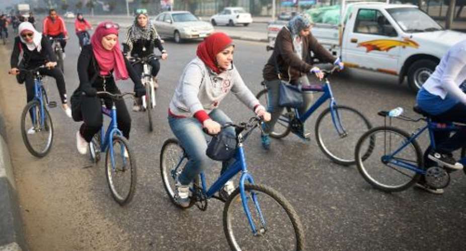 Egyptian members of the Go Bike group take part in a bicycle ride in Cairo, on December 27, 2014.  By Mohamed El-Shahed AFP