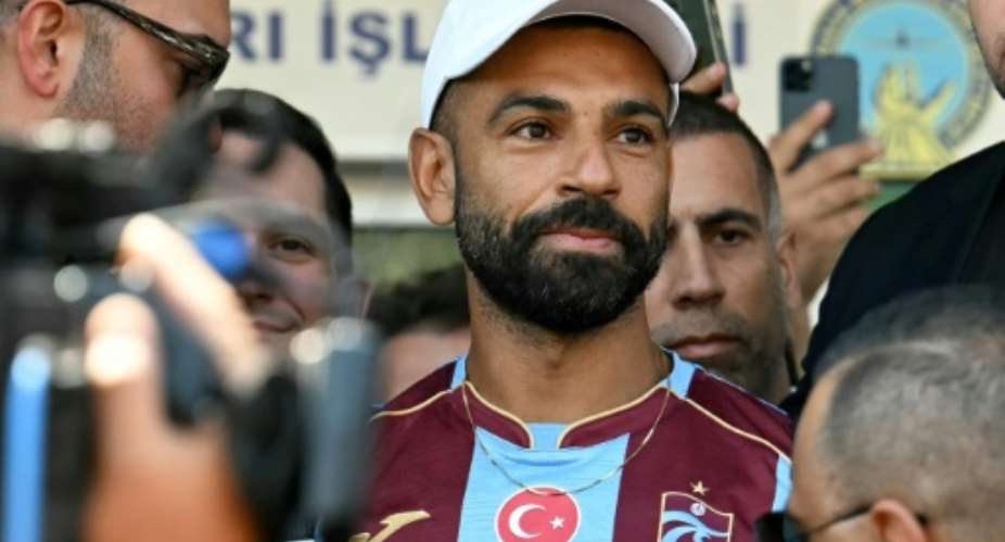 Egyptian forward Mohamed Salah arrives at Istanbul Ataturk Airport to complete his transfer to Turkish club Trabzonspor.  By Ozan KOSE (AFP)