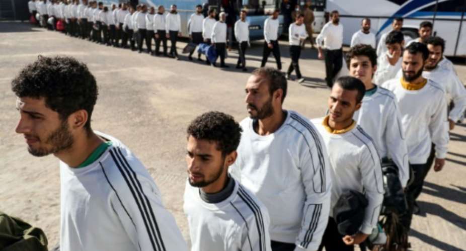 Egyptian migrants awaiting deportation by the Tripoli-based government.  By Mahmud Turkia (AFP)