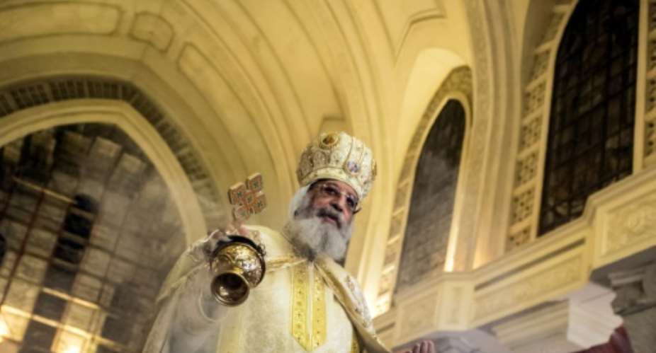 Egyptian Pope Tawadros II, pictured in 2017, led a Christmas service at a massive new cathedral east of Cairo.  By KHALED DESOUKI AFPFile