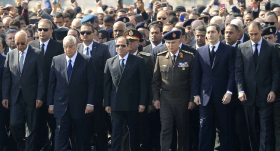 Egyptian President Abdel Fattah al-Sisi C and the sons of of former president Hosni Mubarak, Alaa 2nd R and Gamal R, attend Mubarak's funeral ceremony.  By Khaled DESOUKI AFP